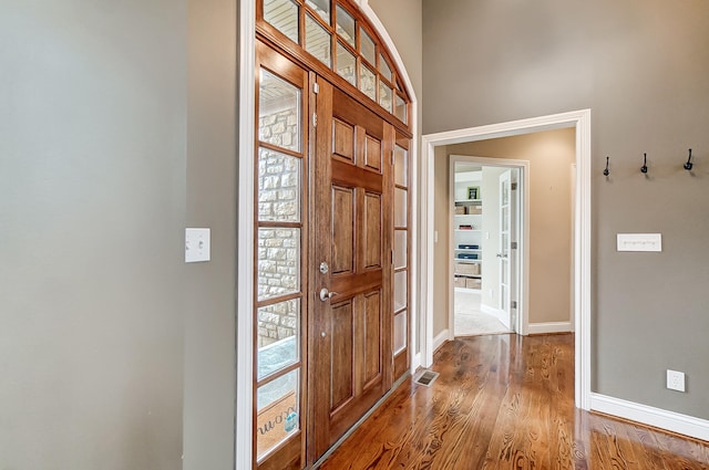 foyer with wood-type flooring