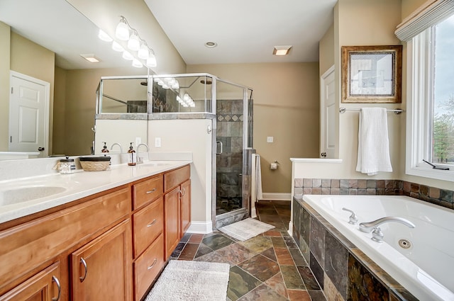 bathroom featuring separate shower and tub and vanity