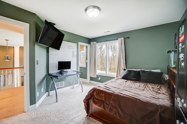 bedroom featuring light carpet