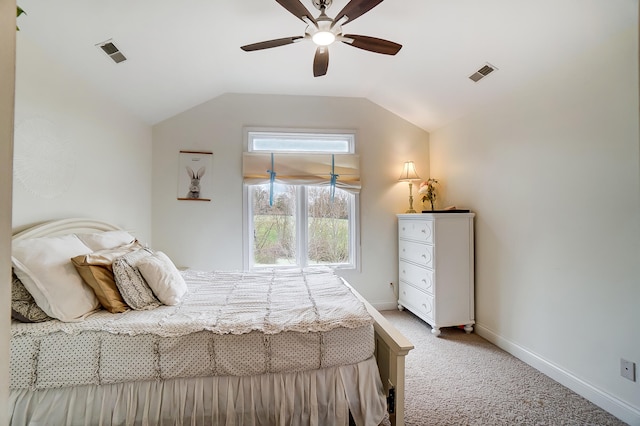 carpeted bedroom with ceiling fan and lofted ceiling