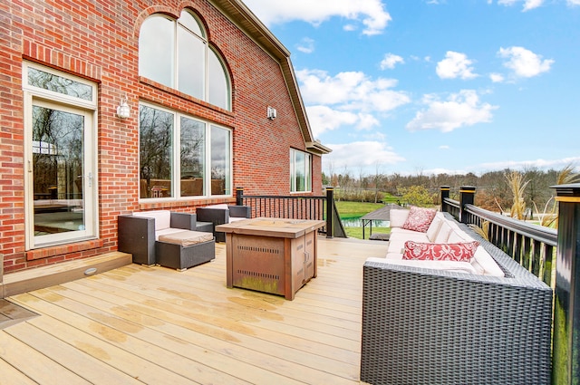 wooden terrace with an outdoor living space