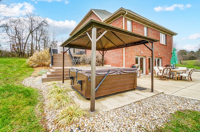 view of patio / terrace featuring a hot tub