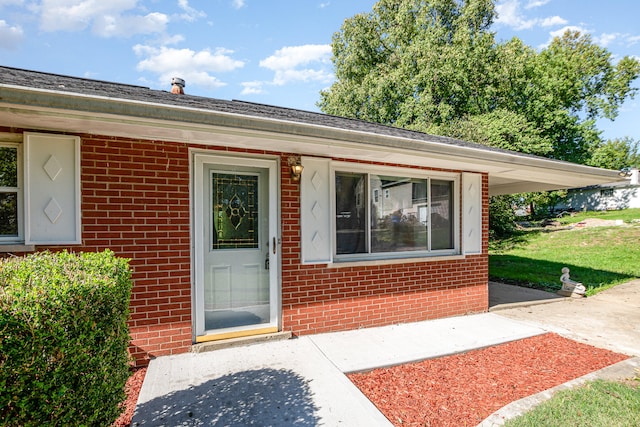 property entrance featuring a patio area