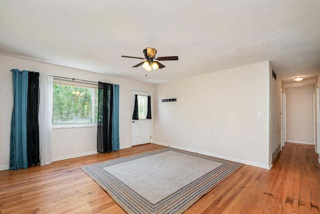 unfurnished room featuring light hardwood / wood-style flooring and ceiling fan