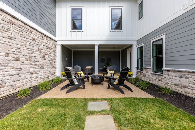 view of patio / terrace featuring an outdoor fire pit