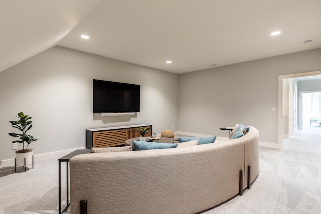 living room with lofted ceiling and light carpet