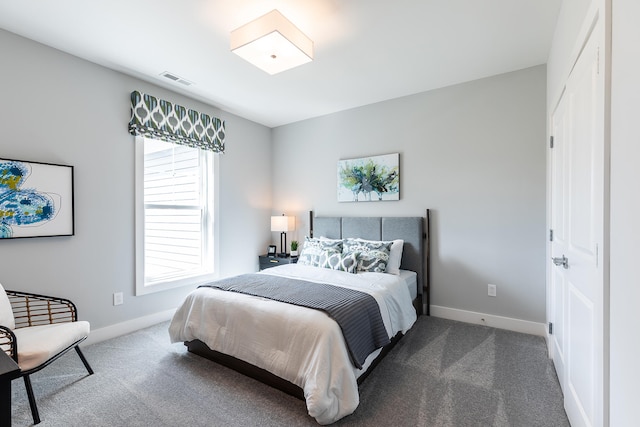 carpeted bedroom with a closet