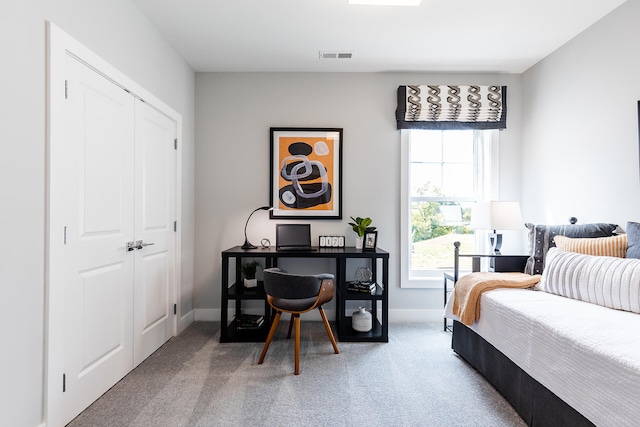 bedroom with carpet floors and a closet