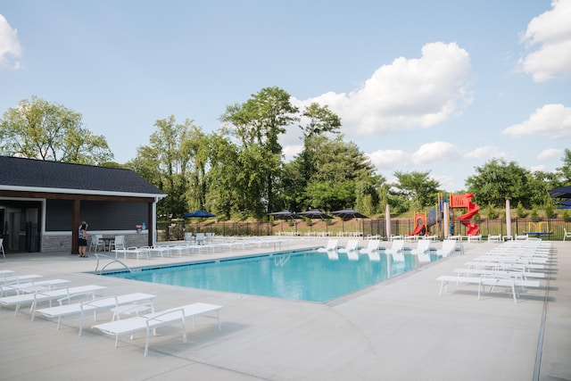 view of swimming pool featuring a patio area