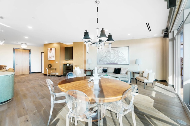 dining space featuring light wood-type flooring