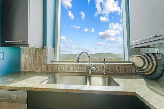 kitchen featuring sink, a mountain view, and dishwasher