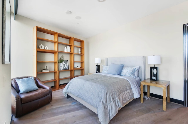 bedroom featuring hardwood / wood-style flooring