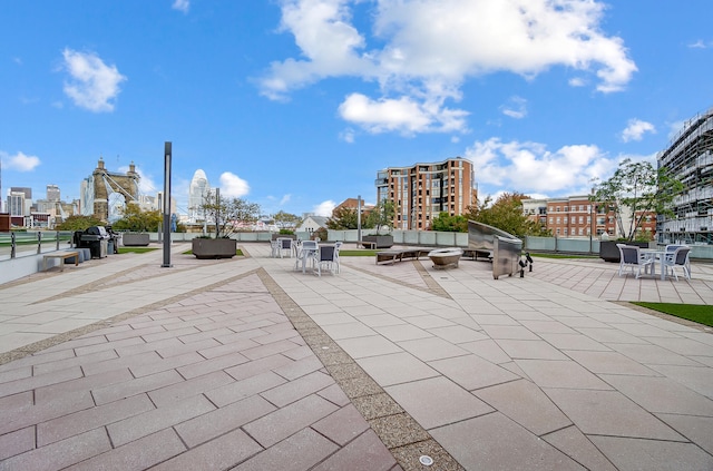 view of community featuring a patio area and an outdoor hangout area