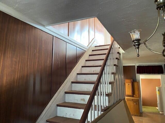 staircase featuring hardwood / wood-style flooring