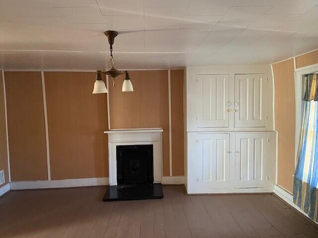 unfurnished living room with hardwood / wood-style floors