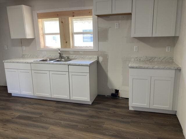 kitchen featuring sink, dark hardwood / wood-style floors, and white cabinets