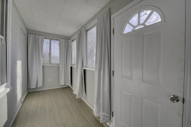 unfurnished sunroom featuring a healthy amount of sunlight