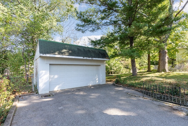 detached garage with fence