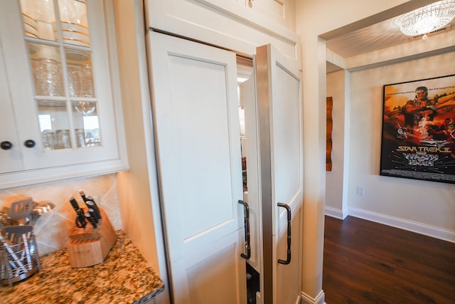 hallway featuring dark wood-type flooring