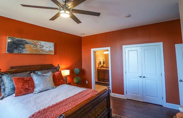 bedroom featuring ensuite bathroom, a closet, dark hardwood / wood-style flooring, and ceiling fan