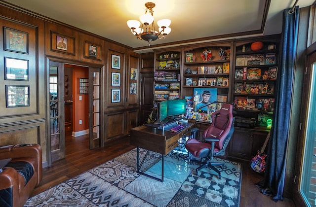 office area with an inviting chandelier and dark hardwood / wood-style flooring