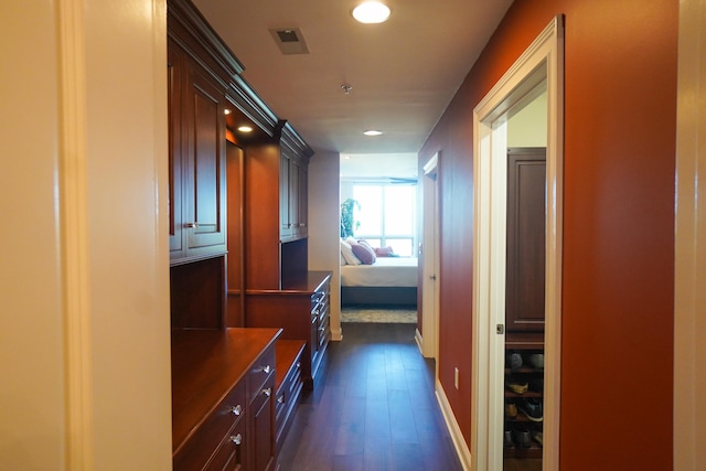 corridor featuring dark hardwood / wood-style flooring