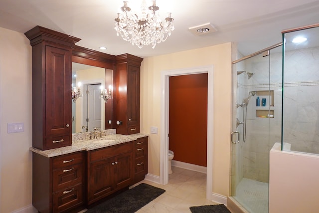 bathroom with vanity, tile patterned floors, an enclosed shower, an inviting chandelier, and toilet