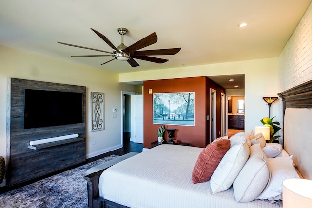 bedroom with ensuite bathroom and ceiling fan