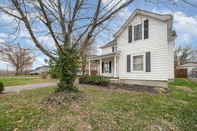 view of front facade with a front lawn and a porch