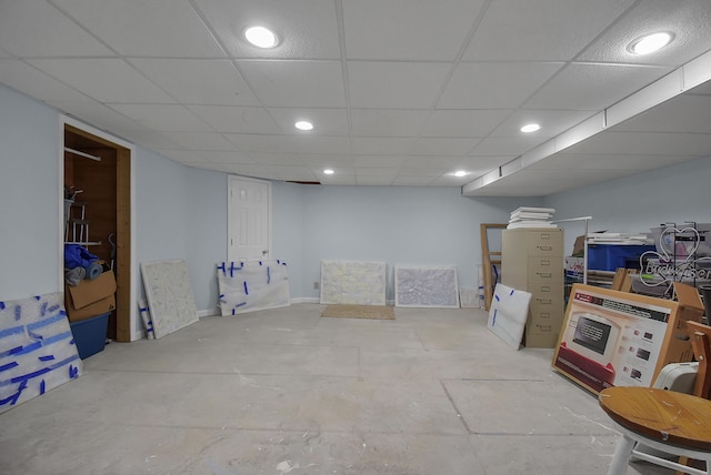 finished basement featuring recessed lighting and a paneled ceiling