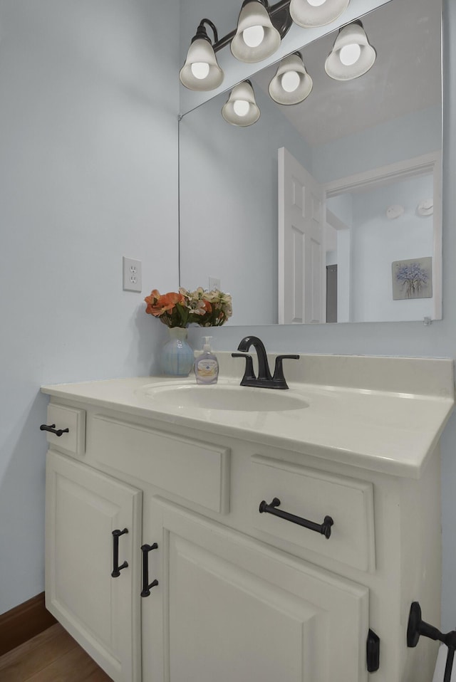 bathroom featuring vanity and wood finished floors