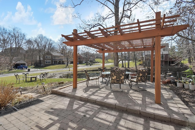 view of patio / terrace with a pergola and an outdoor fire pit