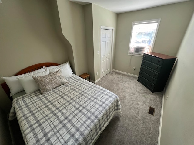 bedroom with light colored carpet