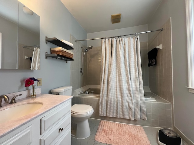 full bathroom featuring shower / bath combination with curtain, tile patterned floors, toilet, and vanity