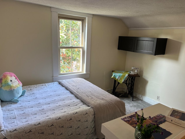 bedroom featuring lofted ceiling, light colored carpet, and a textured ceiling