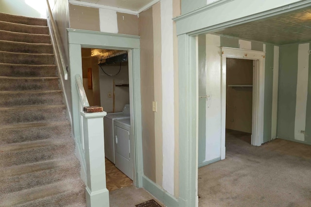 staircase with washer and dryer and carpet floors