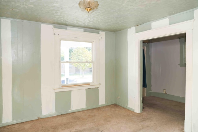 empty room with light colored carpet