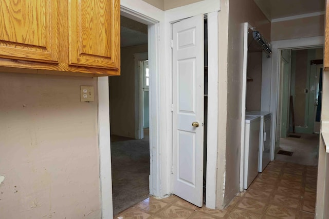 corridor with independent washer and dryer