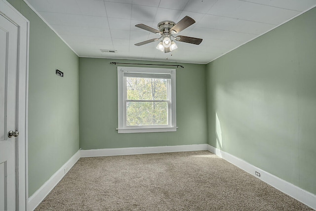 unfurnished room with carpet floors and ceiling fan