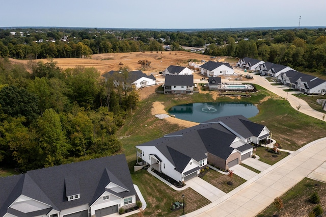bird's eye view with a residential view and a water view