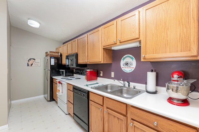 kitchen featuring light brown cabinets, black appliances, and sink