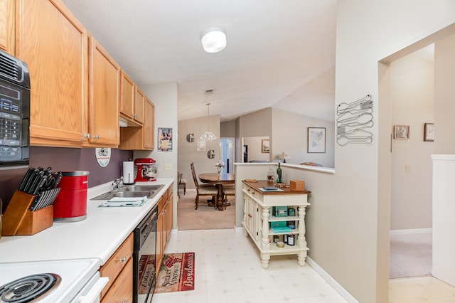 kitchen with sink, white range oven, hanging light fixtures, vaulted ceiling, and black dishwasher