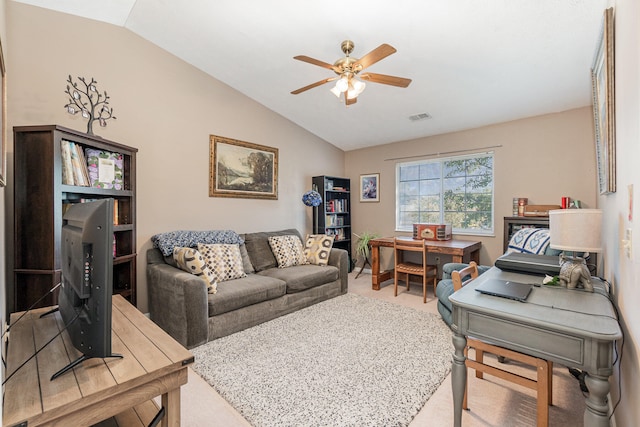 carpeted office featuring vaulted ceiling and ceiling fan