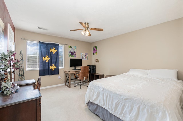 bedroom with light colored carpet and ceiling fan