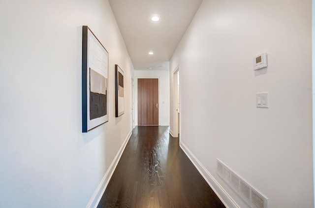 hall featuring dark wood-type flooring