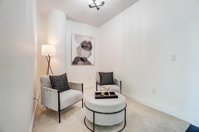 living area featuring light carpet