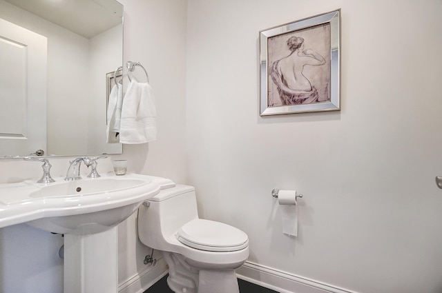 bathroom featuring sink and toilet