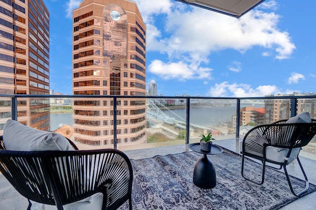 balcony featuring a water view