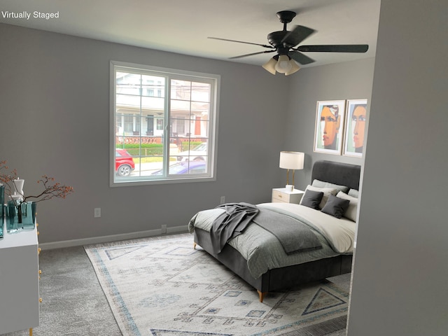 carpeted bedroom with ceiling fan