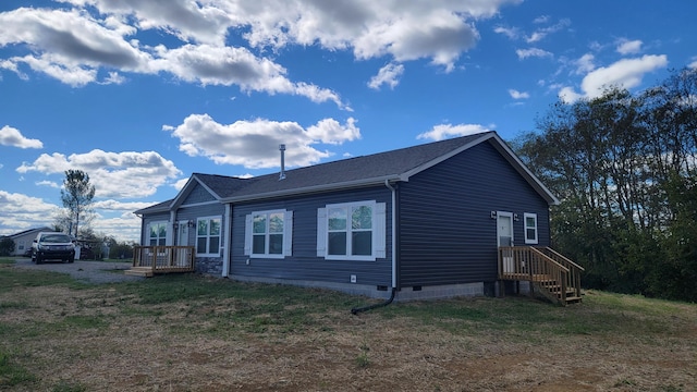 view of property exterior with a wooden deck